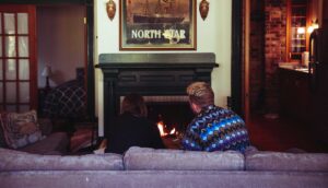 sitting in front of the fireplace, USSC Summer House, Bowen Island